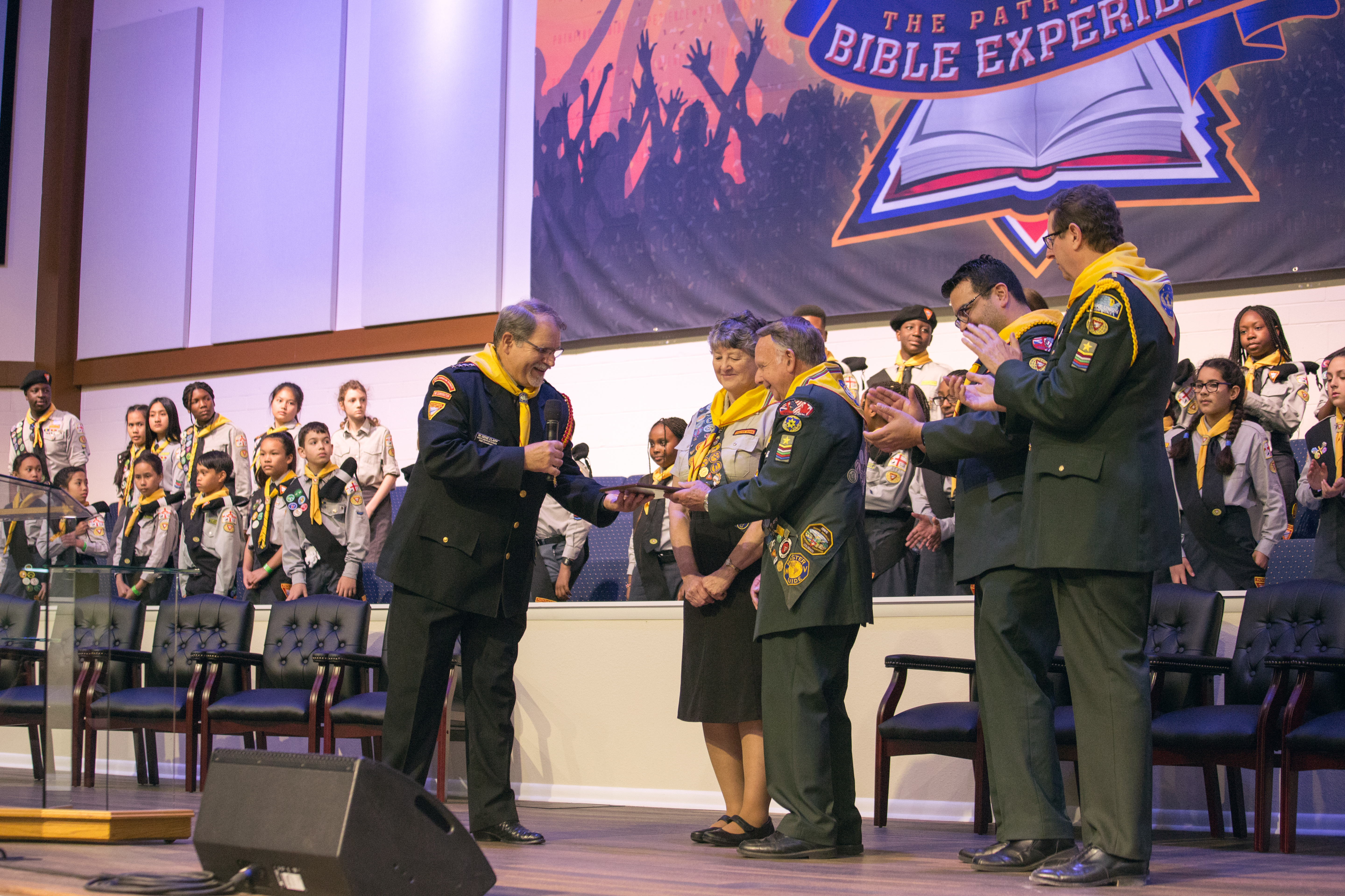 Gene Clapp presents plaque to Terry Dodge for inspiring the creation of the Pathfinder Bible Experience.