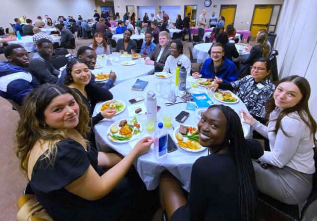 Attendees at the fourth stop of the Young Adult LIFE Tour at the College View church in Lincoln, Nebraska, share a meal together.