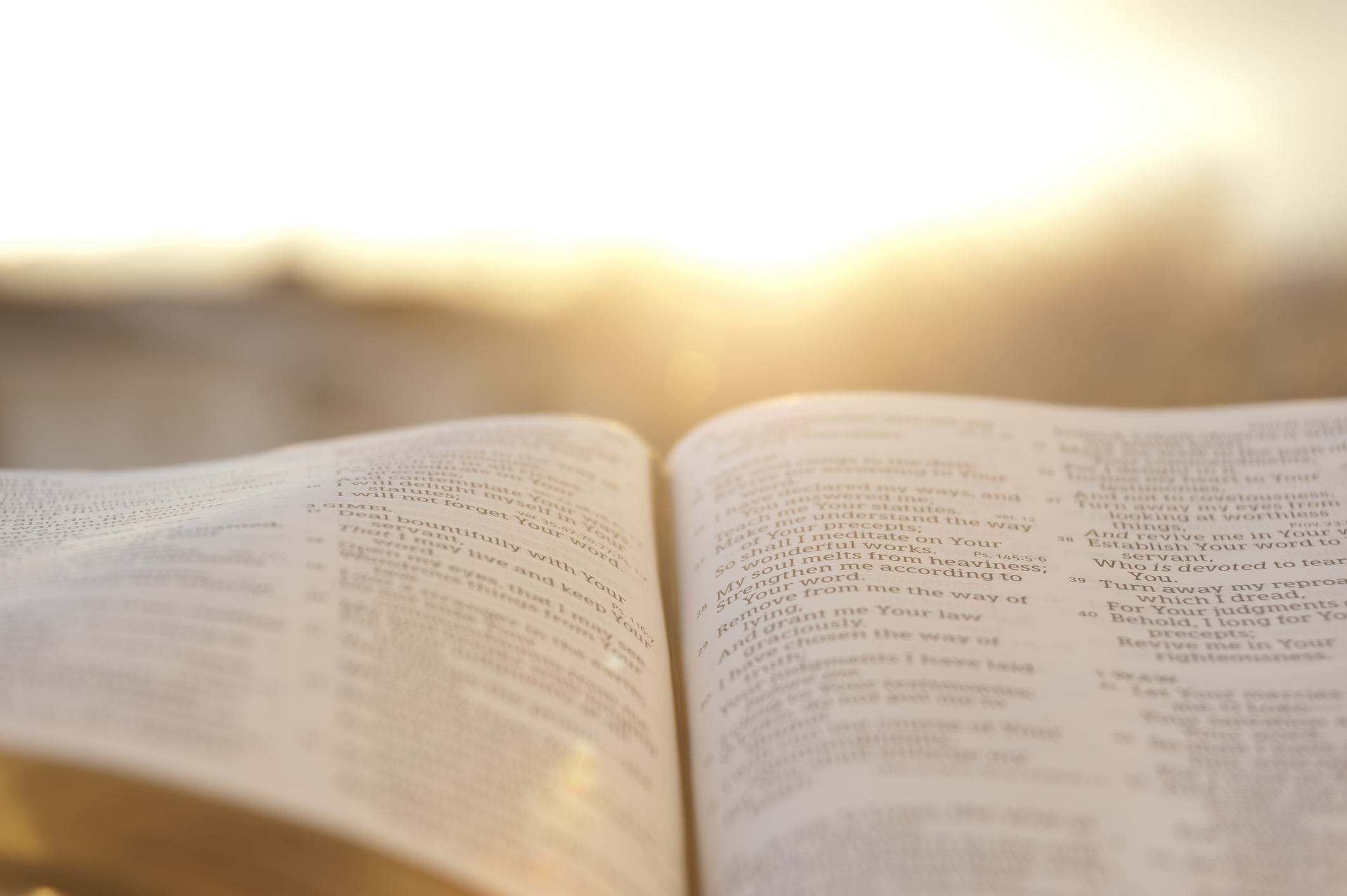 open Bible with sun glow