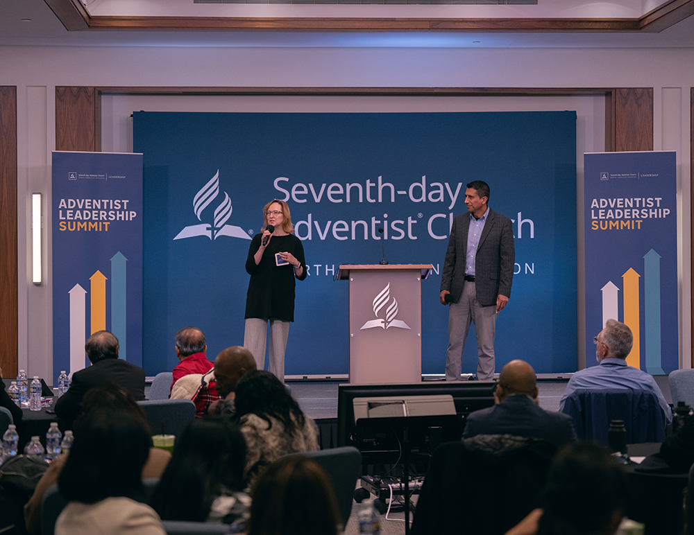 2023 NAD leadership summit hosts Debbie Rivera and John Rengifo address those gathered on Nov. 12.