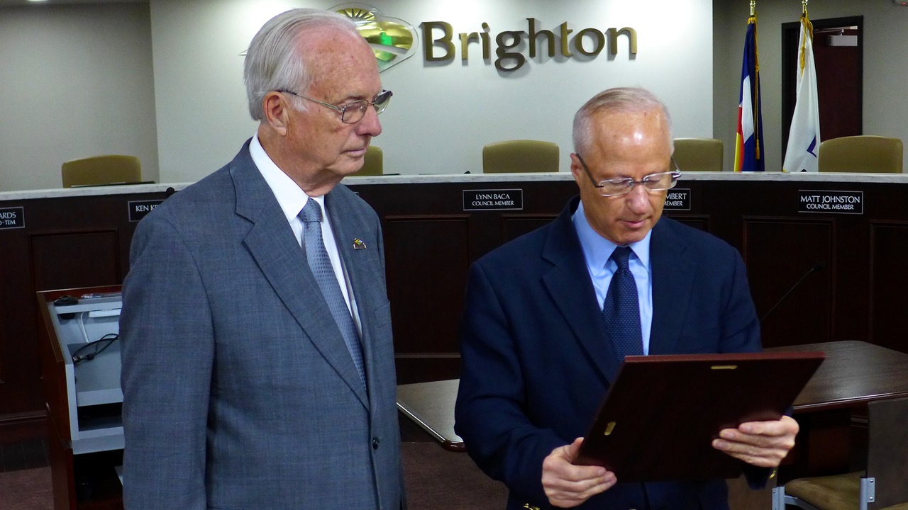 U.S. Representative Mike Coffman (right) presenting Pastor Rex Bell with Congressional Citation, Brighton, May 1, 2018