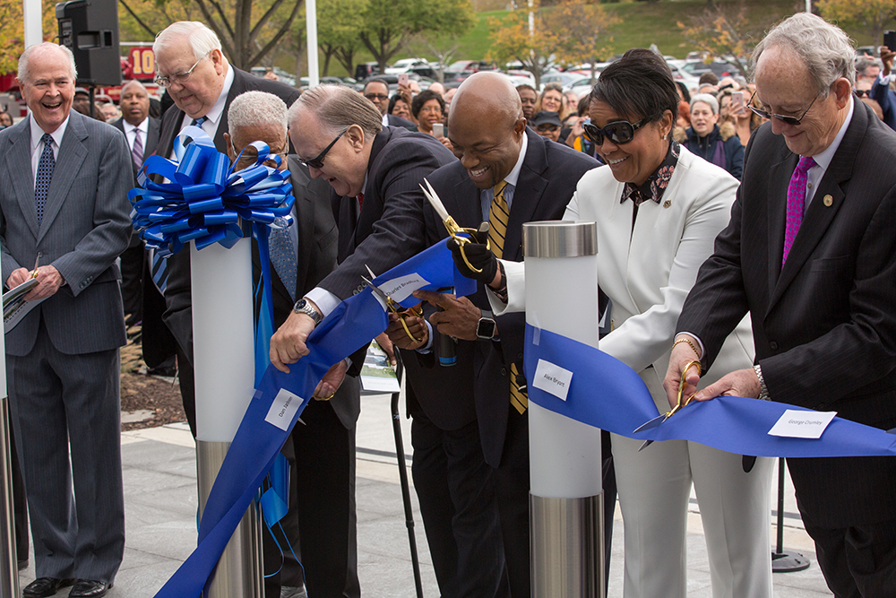 cutting ceremonial ribbon