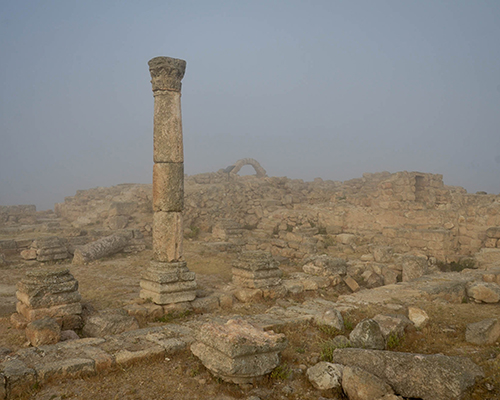 Remains of a Byzantine church; and in the far background, an arch from the Mamluk Dynasty