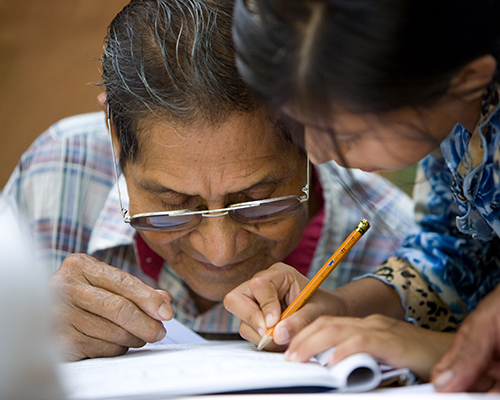 partners in mission literacy program close up of woman learning to read