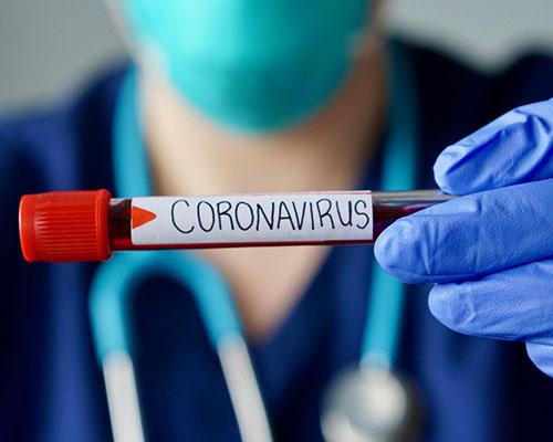 nurse with coronavirus vial