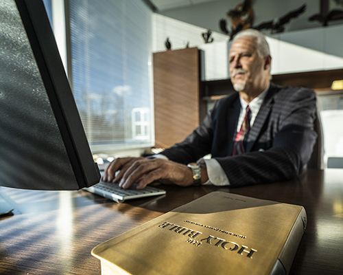 Randy Robinson works on his office computer