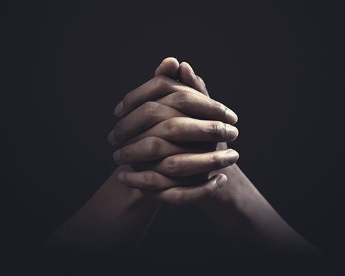 Hands folded in prayer