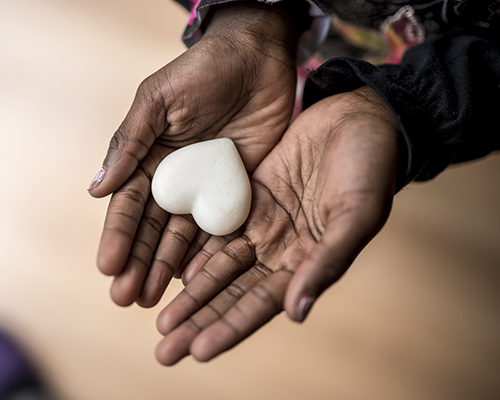 stock photo stone heart in hands