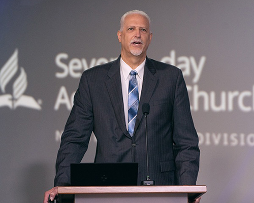 NAD Treasurer Randy Robinson speaking at a podium