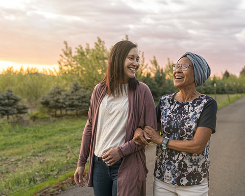 stock photo two women walking path