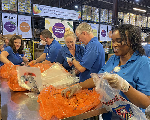 AdventHealth volunteers sort carrots