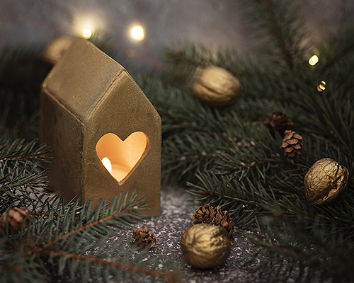 stock photo of candle holder house with heart shape for Christmas