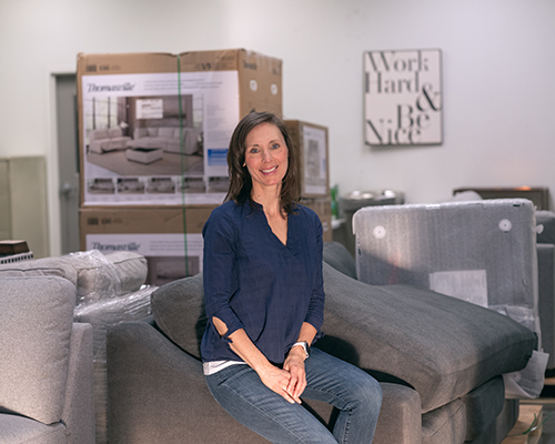 Joelle Chinnock in Paradise warehouse with new furniture, Feb. 2022