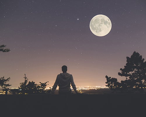 gazing at stars and moon stock photography