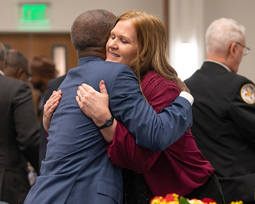 People meeting and hugging