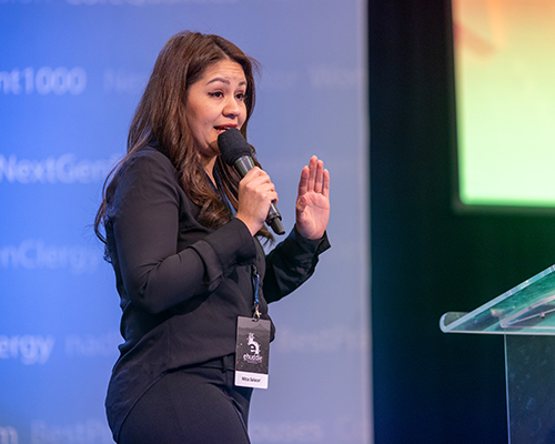 Hispanic woman giving a presentation