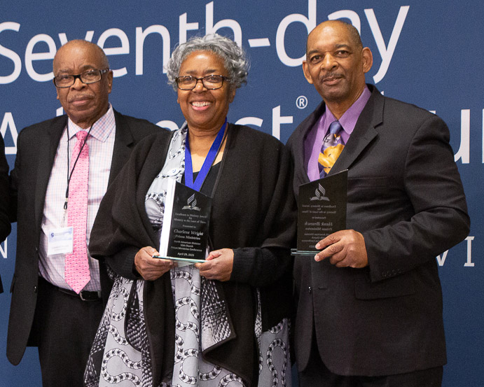 people standing with awards