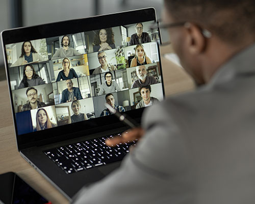 stock photo of young adult male on zoom-type call