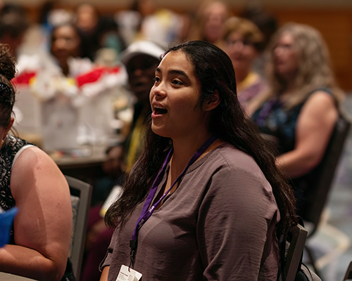 Photo of a young Hispanic woman singing