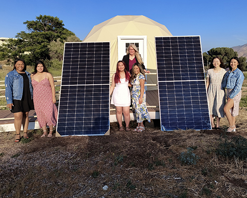 La Sierra University students and professor at the sustainable farm area