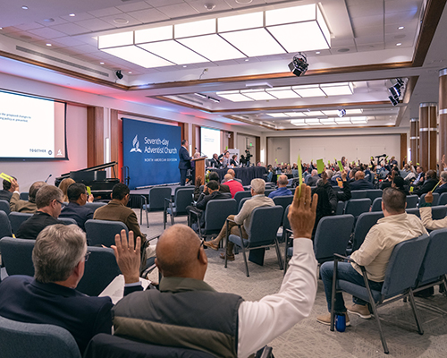 Executive committee members vote on the policy agenda at the 2023 North American Division Year-End Meeting. 