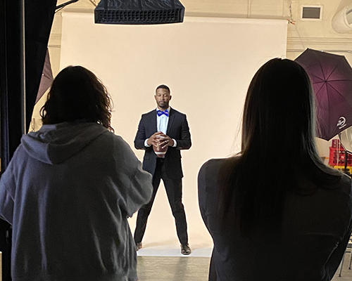 Jeremi Powell (African American young adult man) poses for the Envision cover photoshoot — the magazine was recently awarded a 2023 Pacemaker Award from the Associated Collegiate Press. 