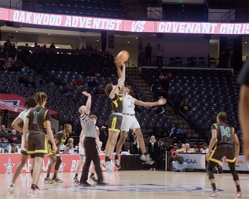 jump ball at Oakwood Adventist Academy boys' basketball final championship game 2023 screenshot