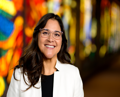 Headshot of a smiling Hispanic woman