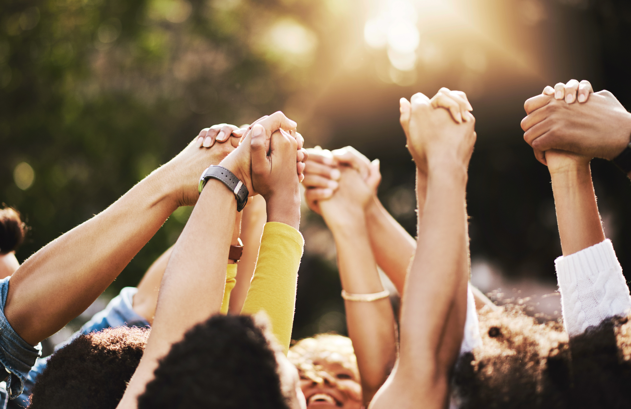 stock photo of hands held and raised