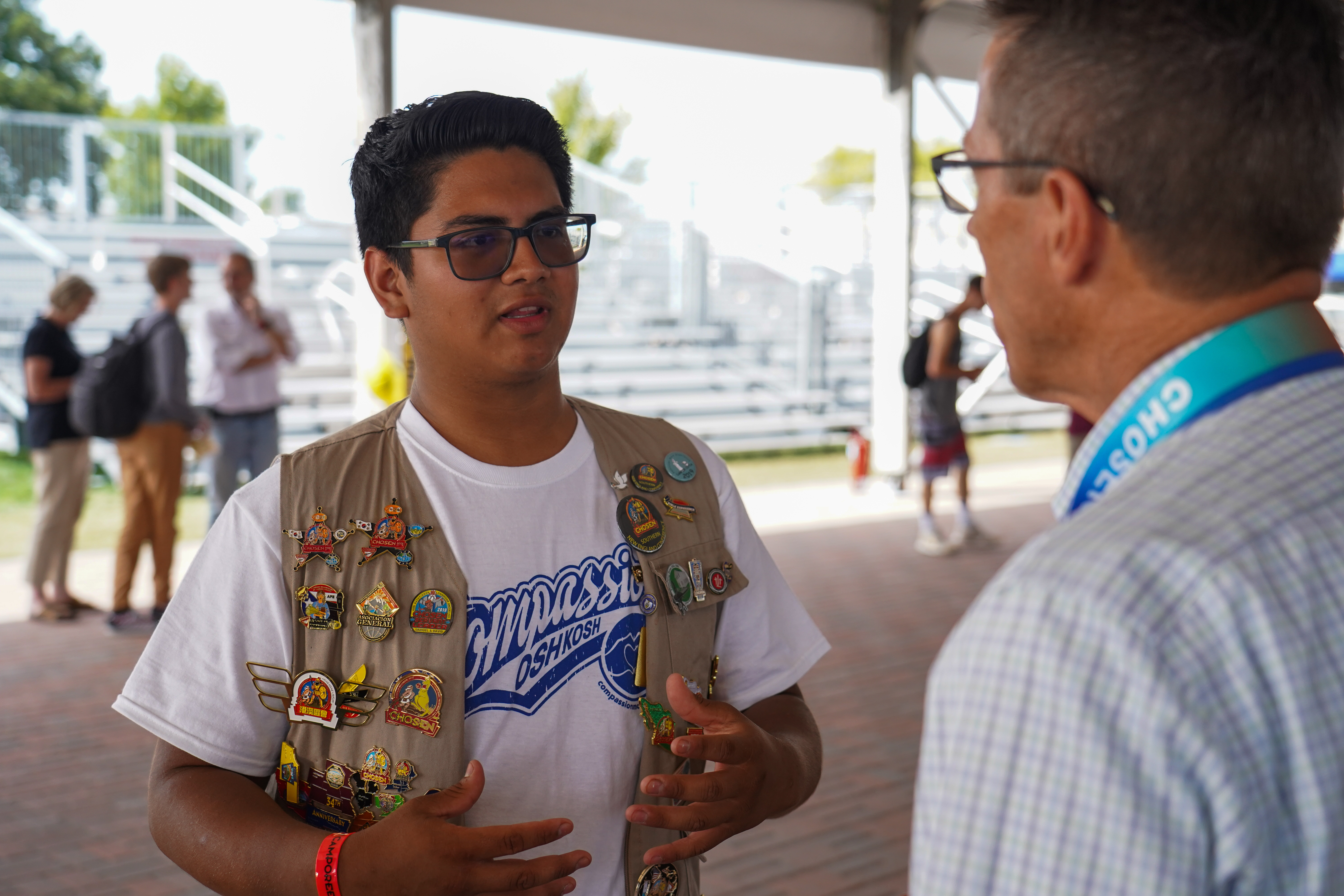 An attendee of the NextGen Ice Cream Social engages with a church leader. 