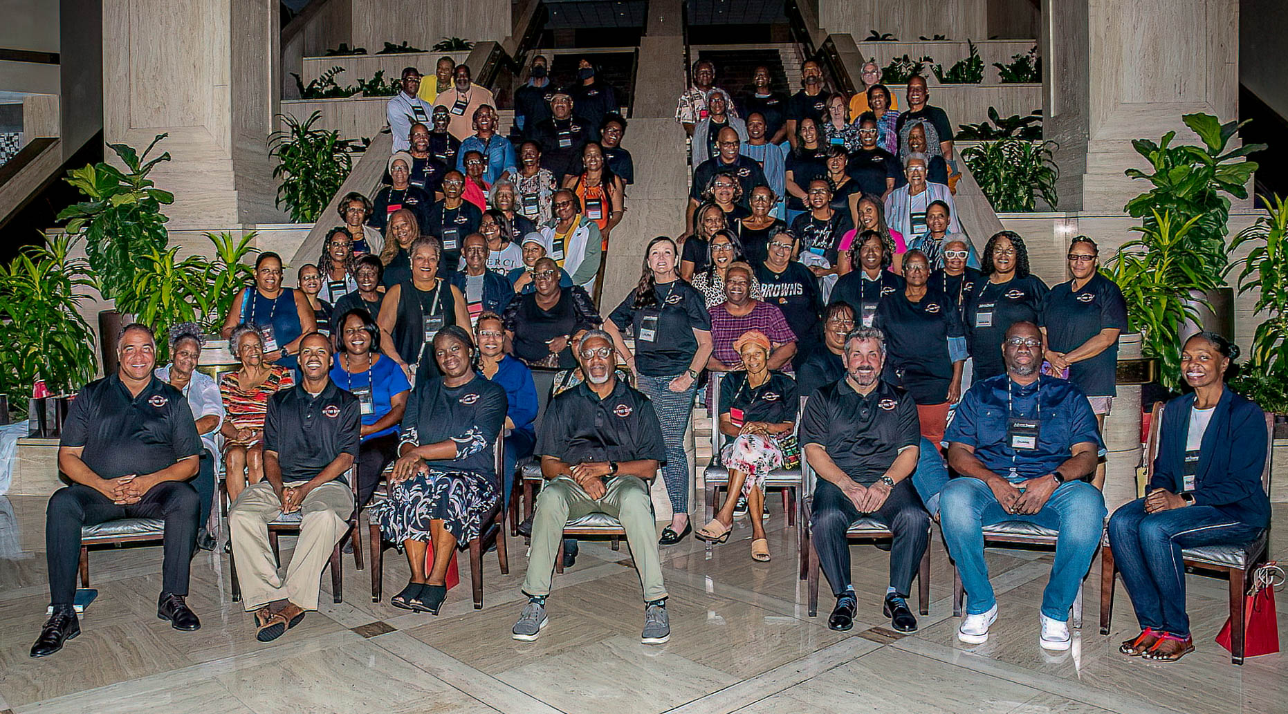 Attendees and organizers of the inaugural Hit the Mark summit pose in the lobby of the Renaissance Hotel in Atlanta, Georgia. 