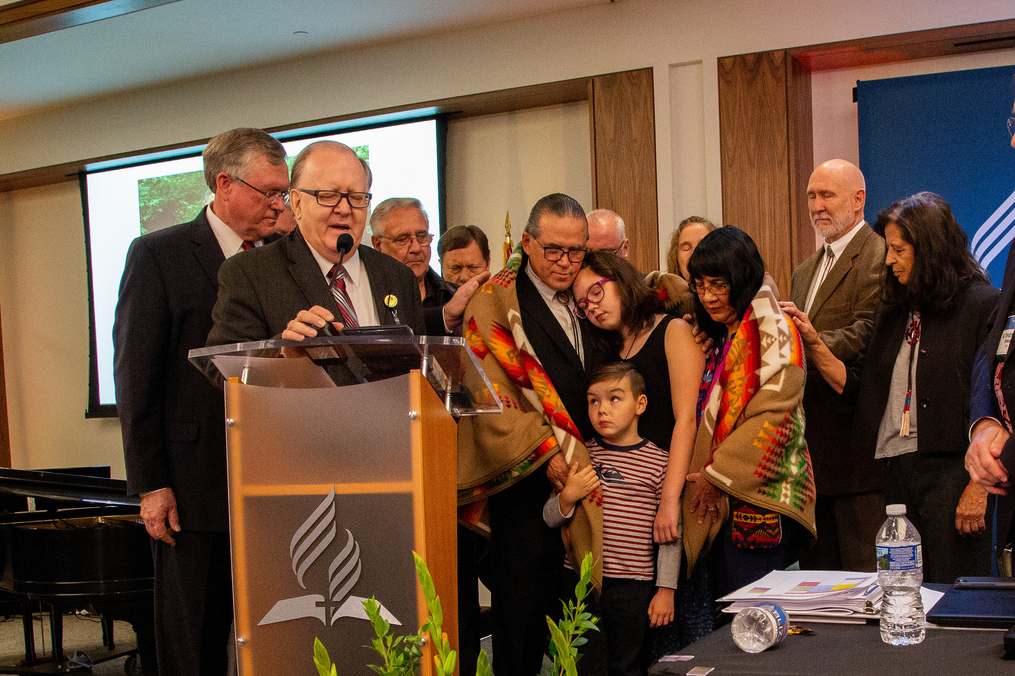 Daniel Jackson, president of the North American Division, leads out a special prayer over the Cladoosby famiily. NAD/Mylon Medley