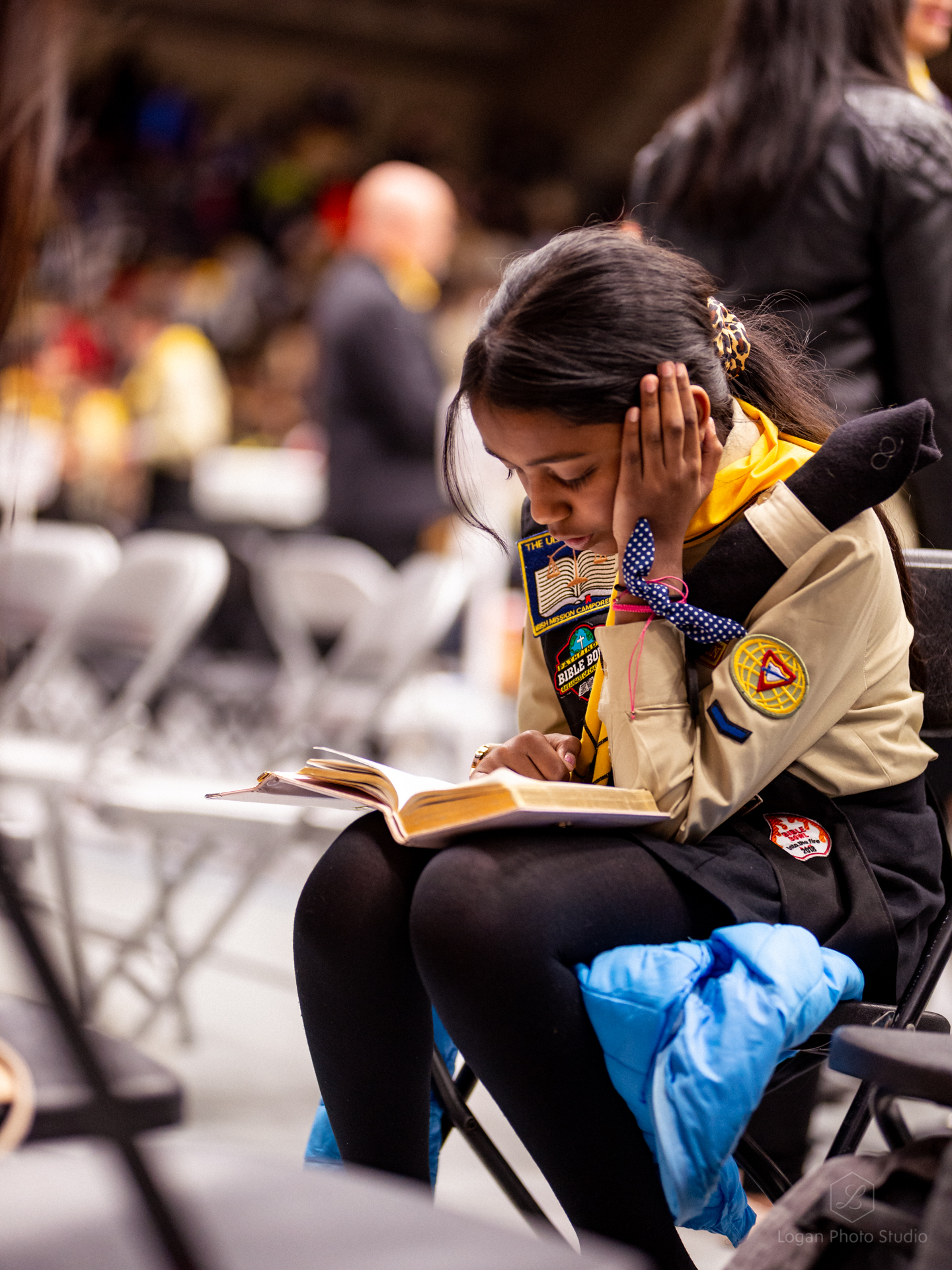 A pathfinder takes a moment to read the Bible. 