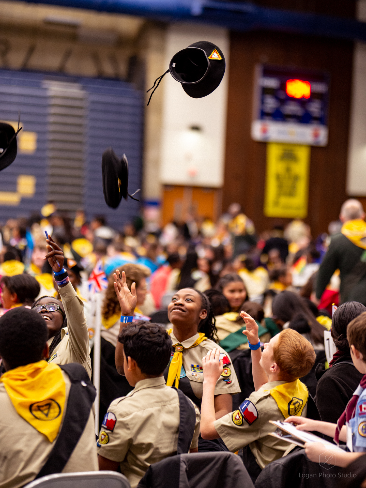 A team celebrates the end of the testing by tossing their berets in the air.