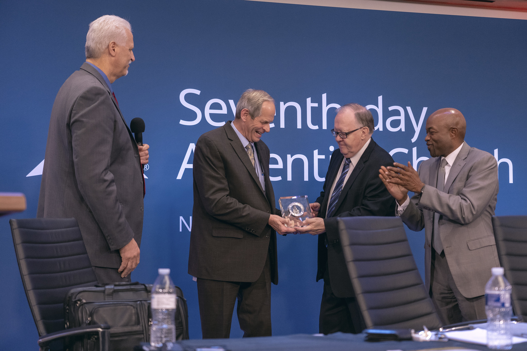 Mike Jamieson, under treasurer, receives a token of appreciation for his many years serving the Adventist Church and the North American Division.