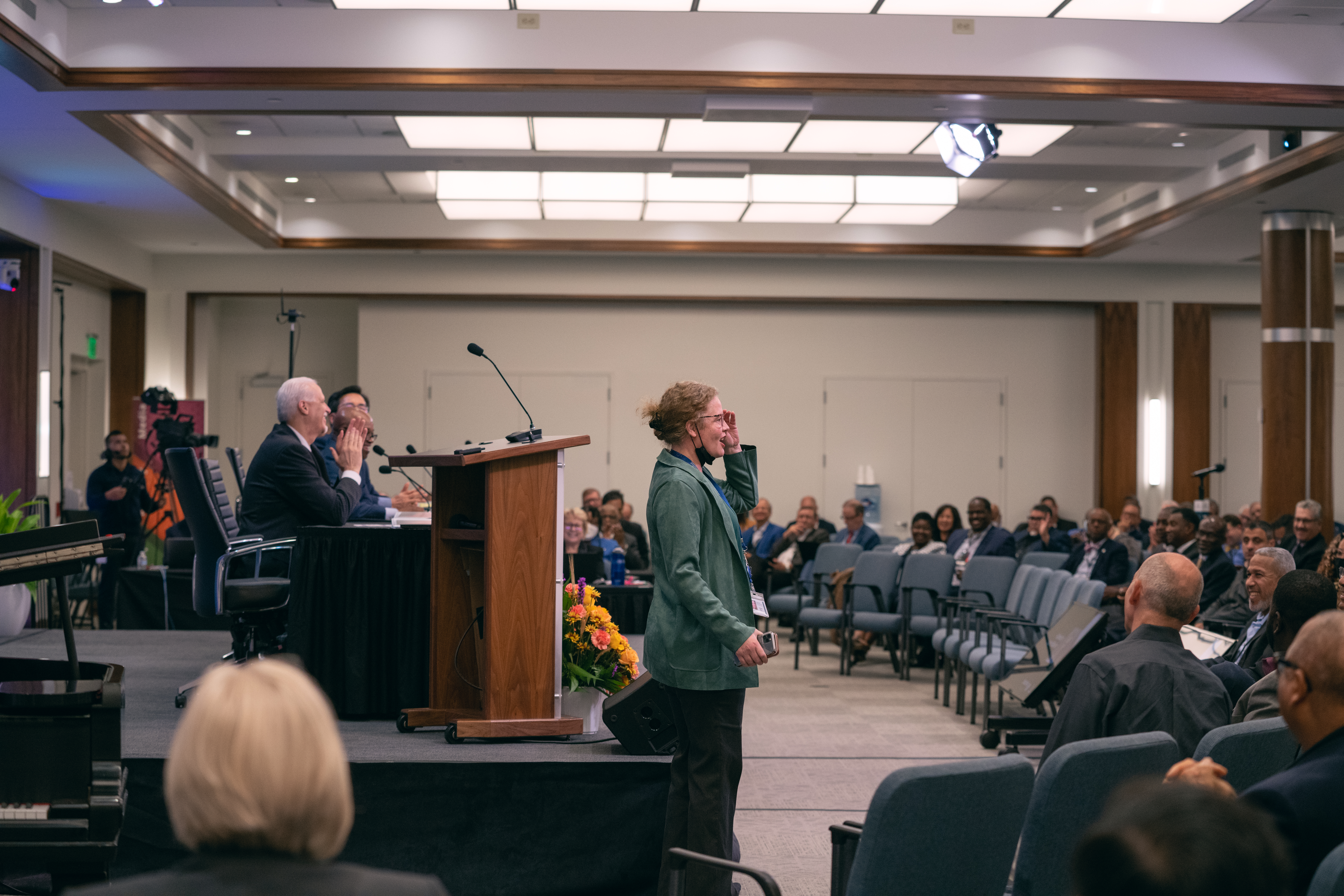 Kimberly Luste Maran waves to the crowd at NADYEM after being elected as Communication director for the North American Division. 