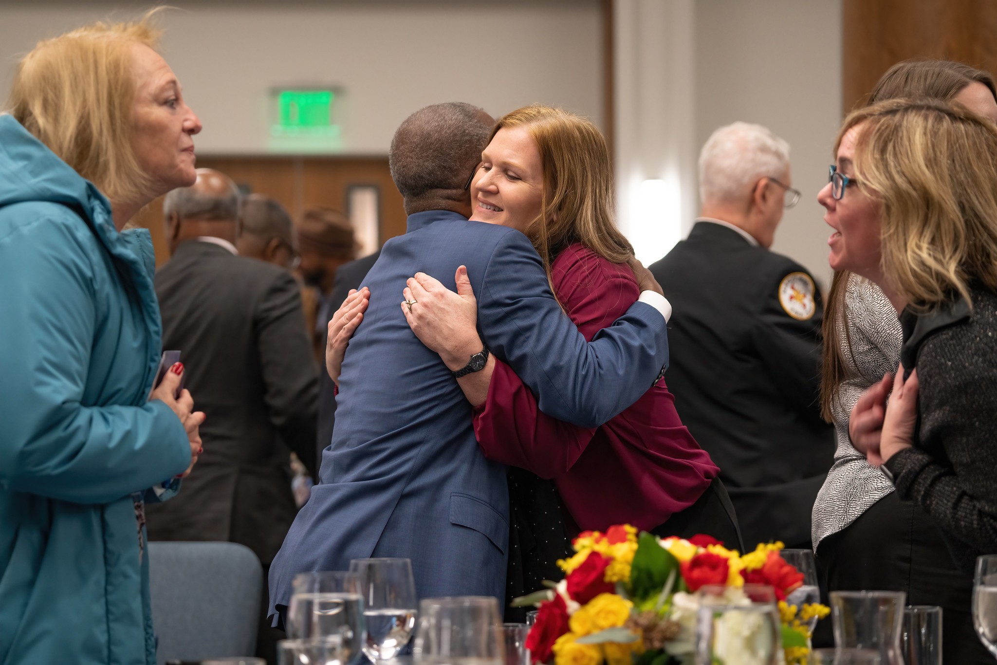 Jan 2023 NAD prayer breakfast attendees hug