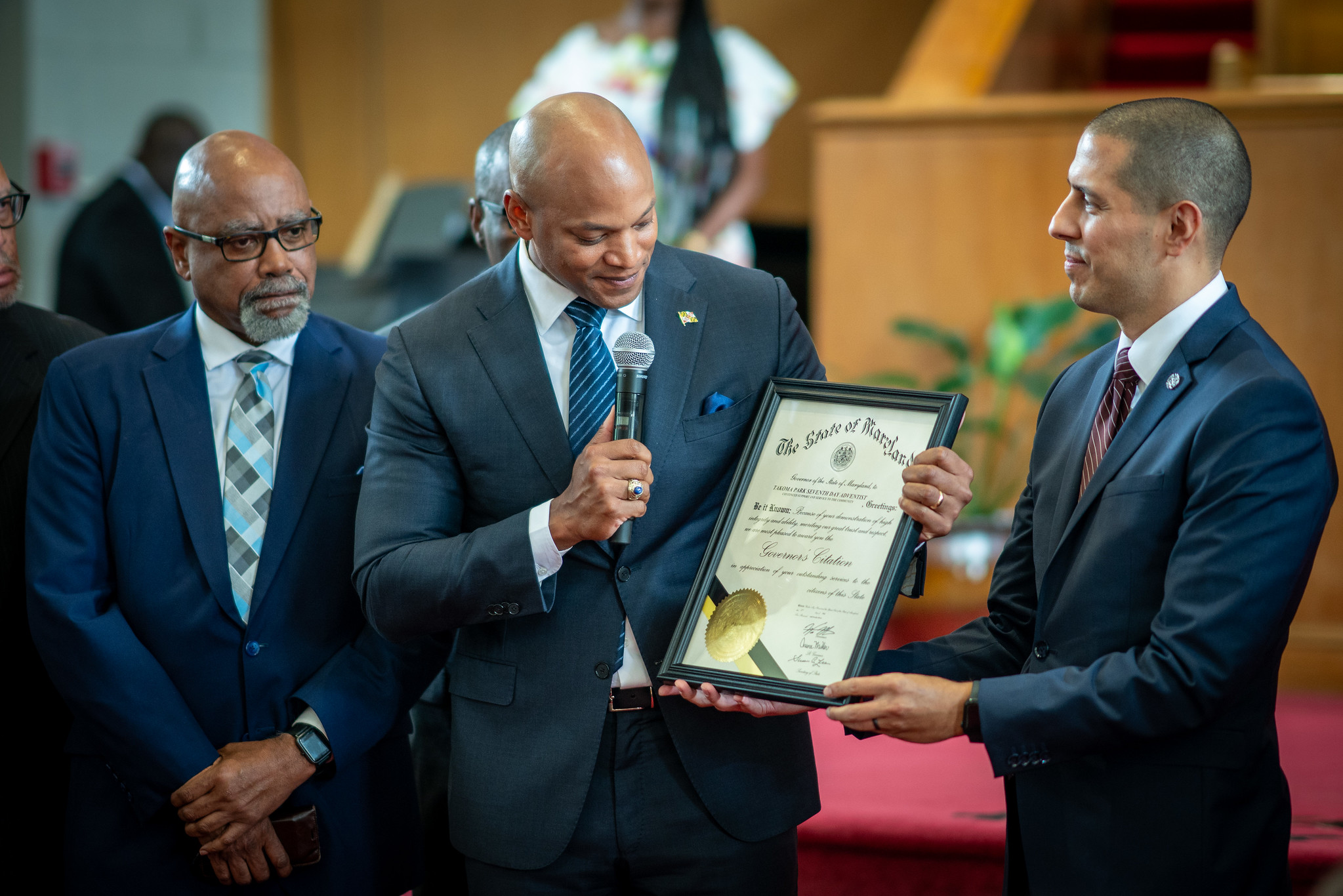 Governor Wes Moore gives a citation to Takoma Park church for their work in the community