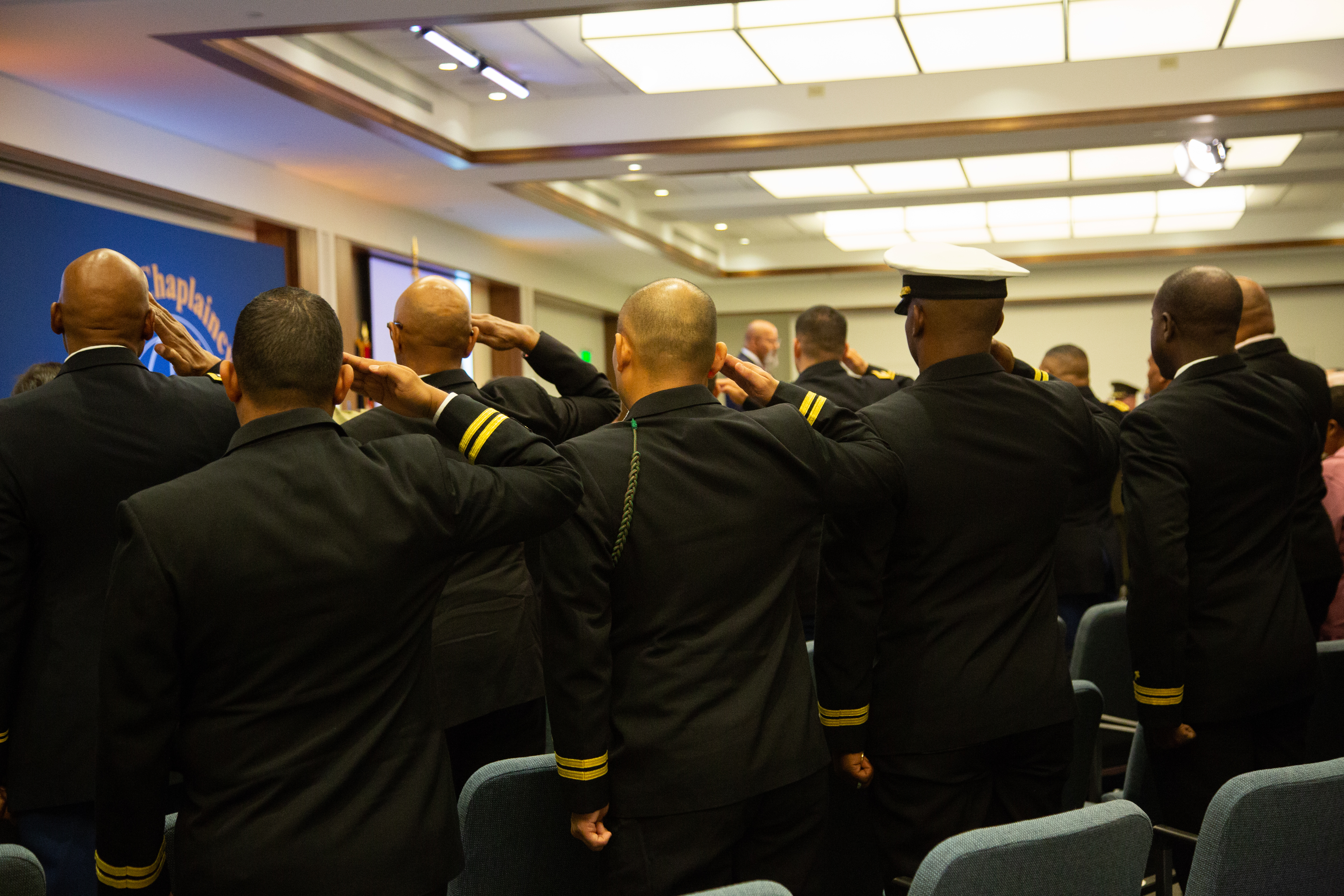 Servicemen salute in memory of Staff Sgt. Stacey Mastrapa who was killed in 2004 while serving in Iraq.