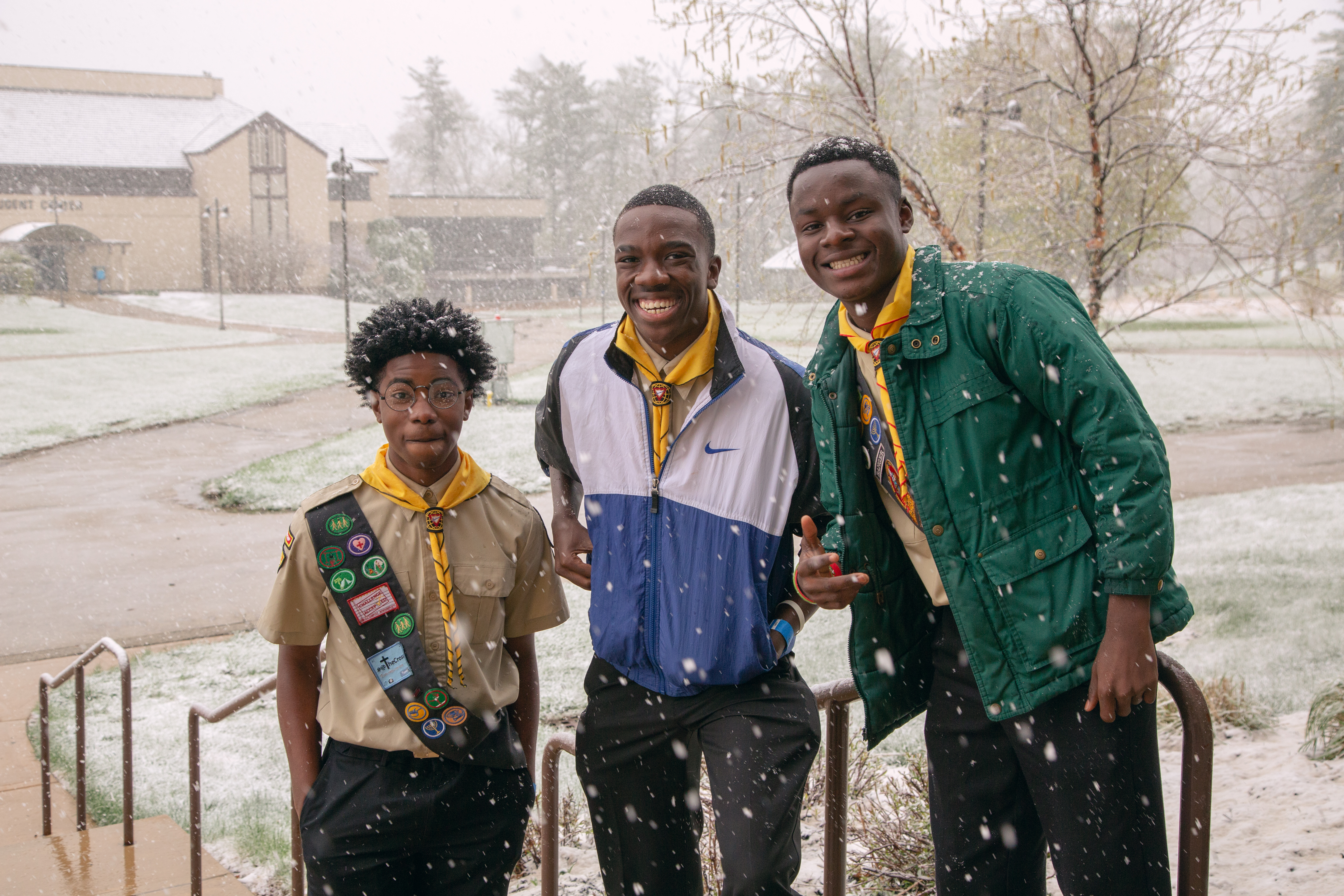 Group of friends pose in the snow outside the auditorium, a welcomed sight for Pathfinders from parts of the country that rarely experience snow.