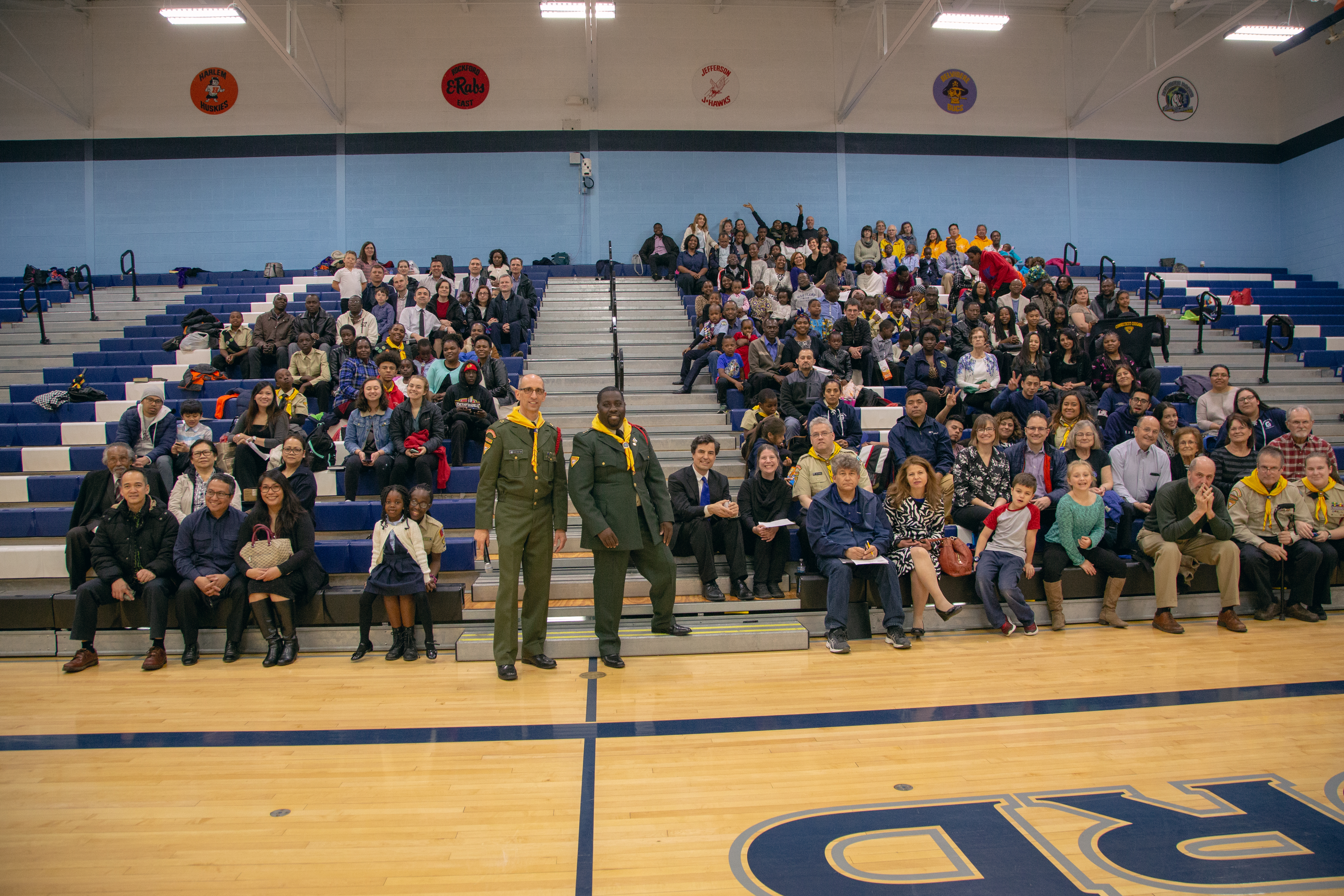 Tracy Wood, director of NAD Youth Ministries, and Vandeon Griffin, associate director of NAD Youth Ministries, pose among parents and supporters of the pathfinders at an off-site location where they answered the same questions given during the testing.