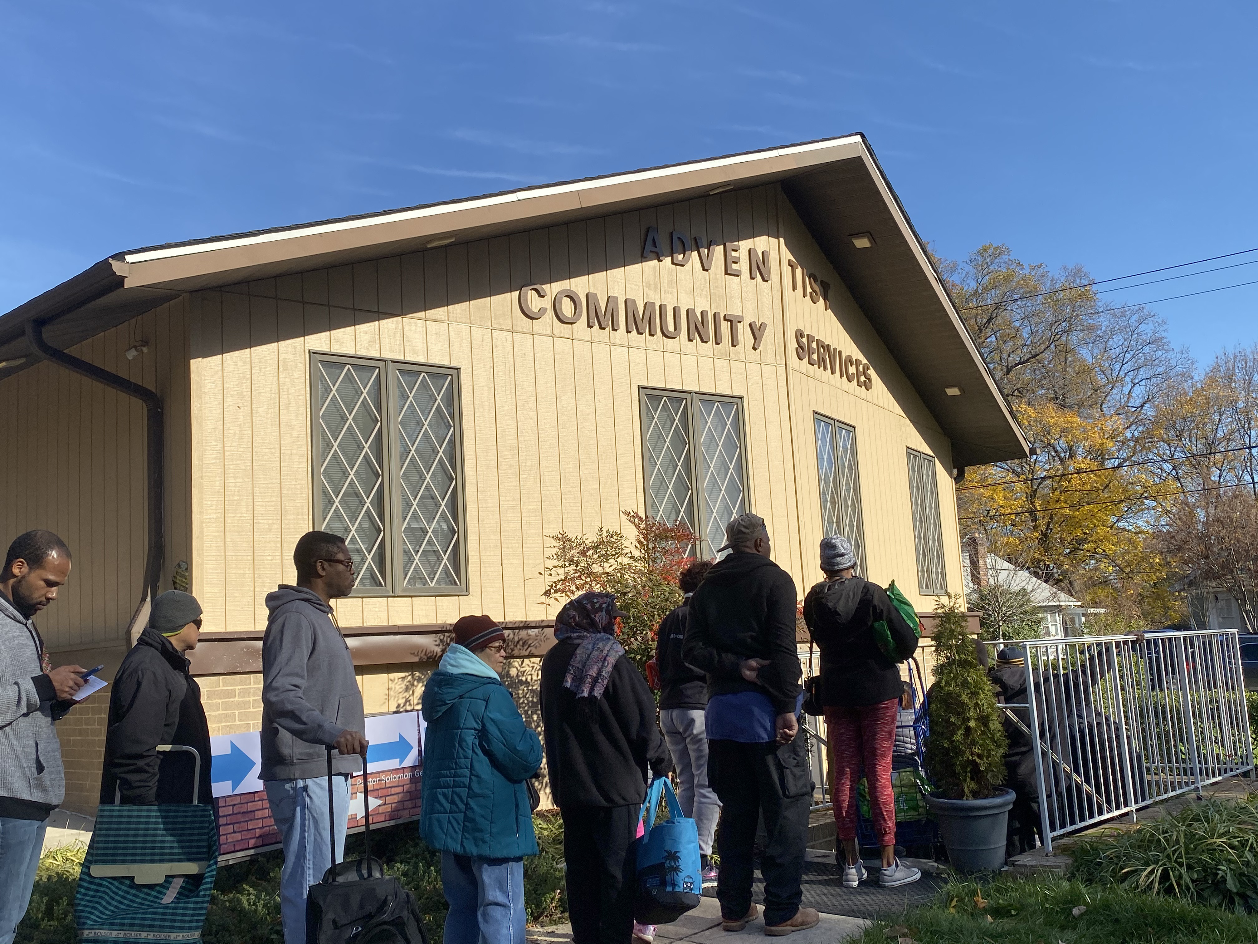 Food basket recipients line up to receive their Thanksgiving meal kit at the Adventist Community Services of Greater Washington location on the border of Takoma Park and Silver Spring, Maryland, on Nov. 25, 2019.