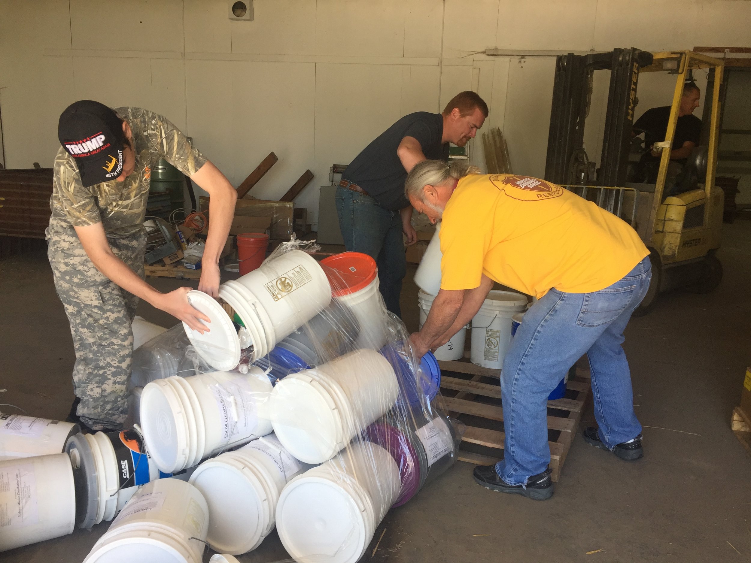 volunteers loading flood buckets