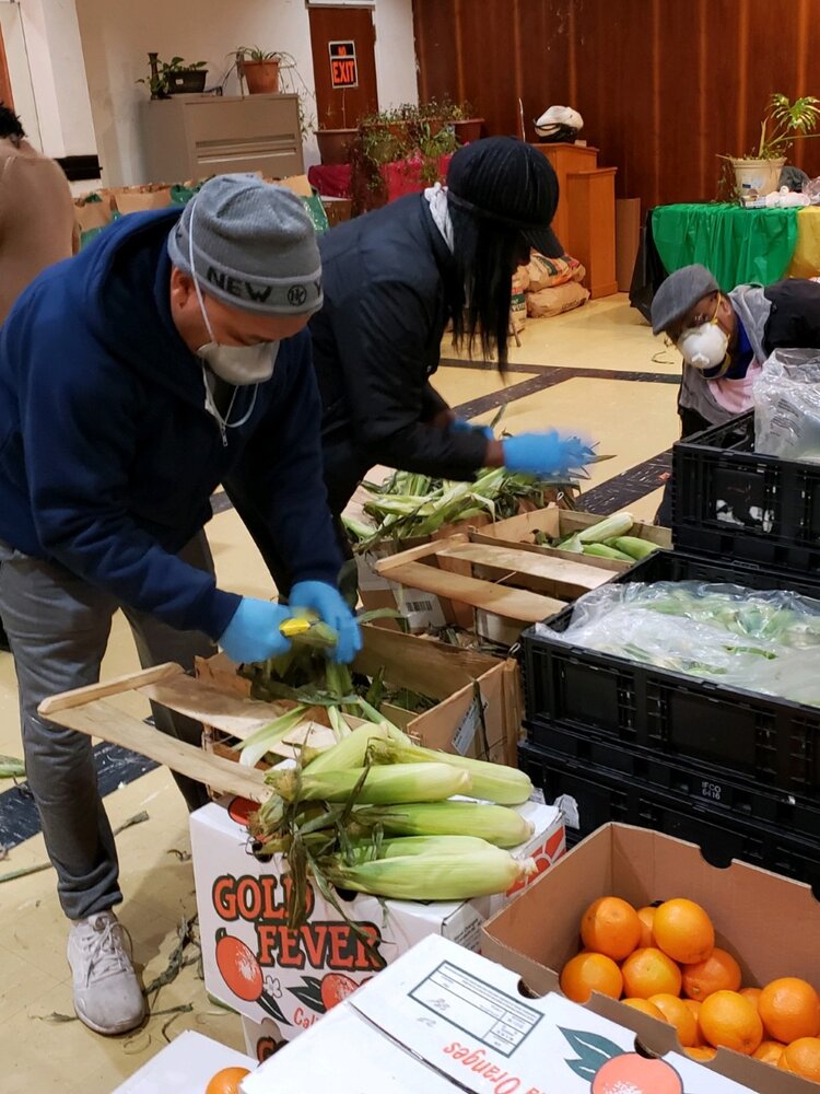 Volunteers get food boxes ready at tThe ACS food pantry of the Allegheny East Conference in Pennsylvania.