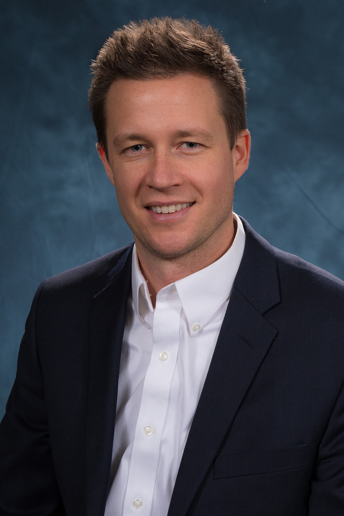 Smiling white man in a suit