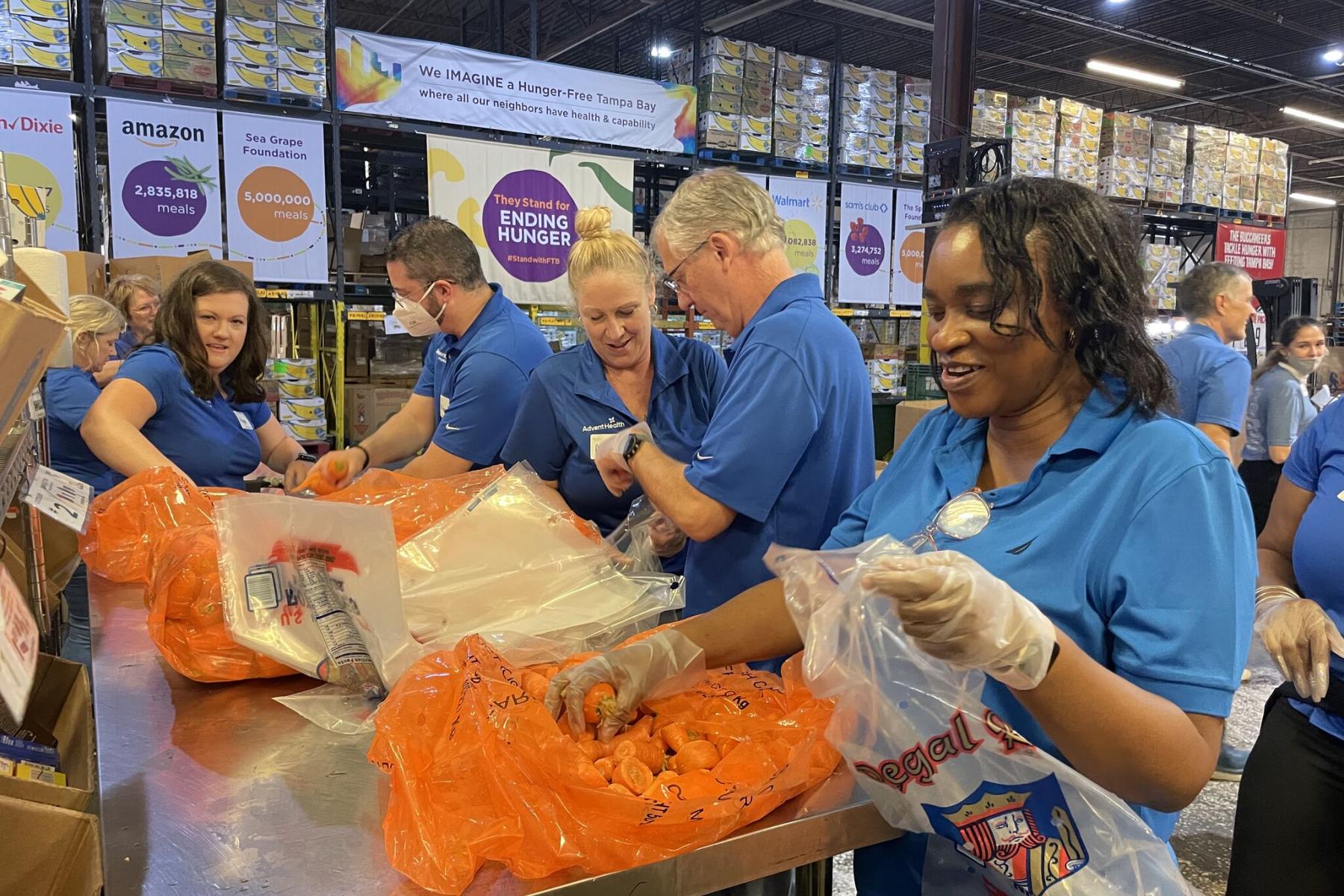 AdventHealth volunteers sort carrots