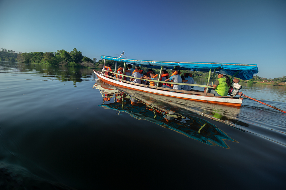 ETAM students traveling by boat to school