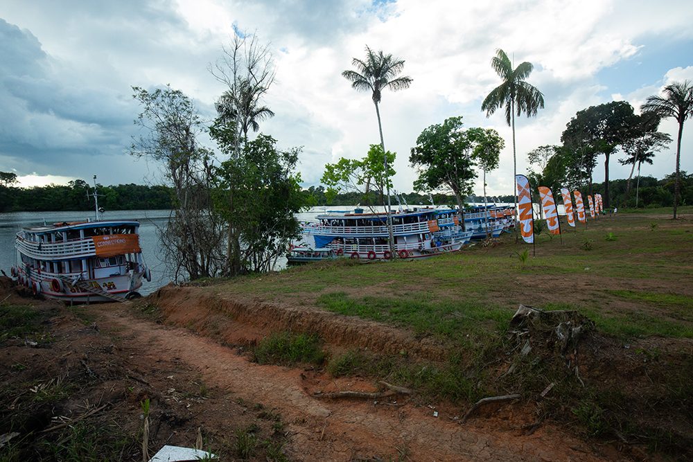 Amazon River boats, which served as living accommodations for the students and volunteers, sit on the shore line in front of the school