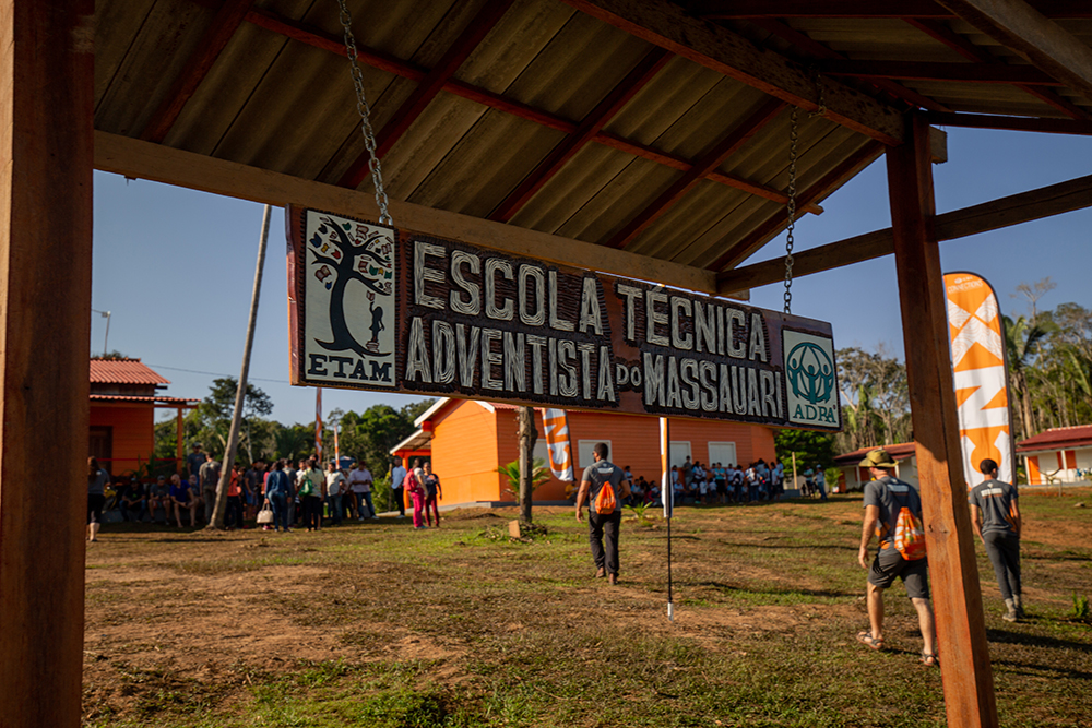 A freshly painted sign is hung before the school’s inauguration ceremony
