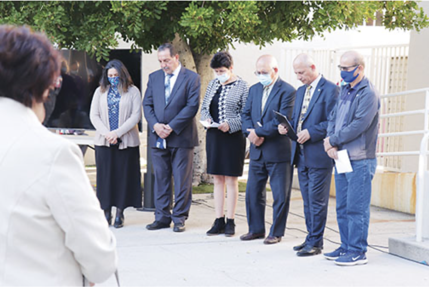 James G. Lee, SCC executive vice president (not pictured), offers prayer over the church officers (left to right): Rita Dekrmenjian, head deaconess; Alexan Dekrmenjian, head deacon; Agapi Zakaryan, clerk/secretary; Hovik Hacopian, head elder; Vigen Khachatryan, pastor; and Aramis Vartanians, treasurer.